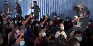 Undocumented immigrants climb wall to evade arrest in KL raid